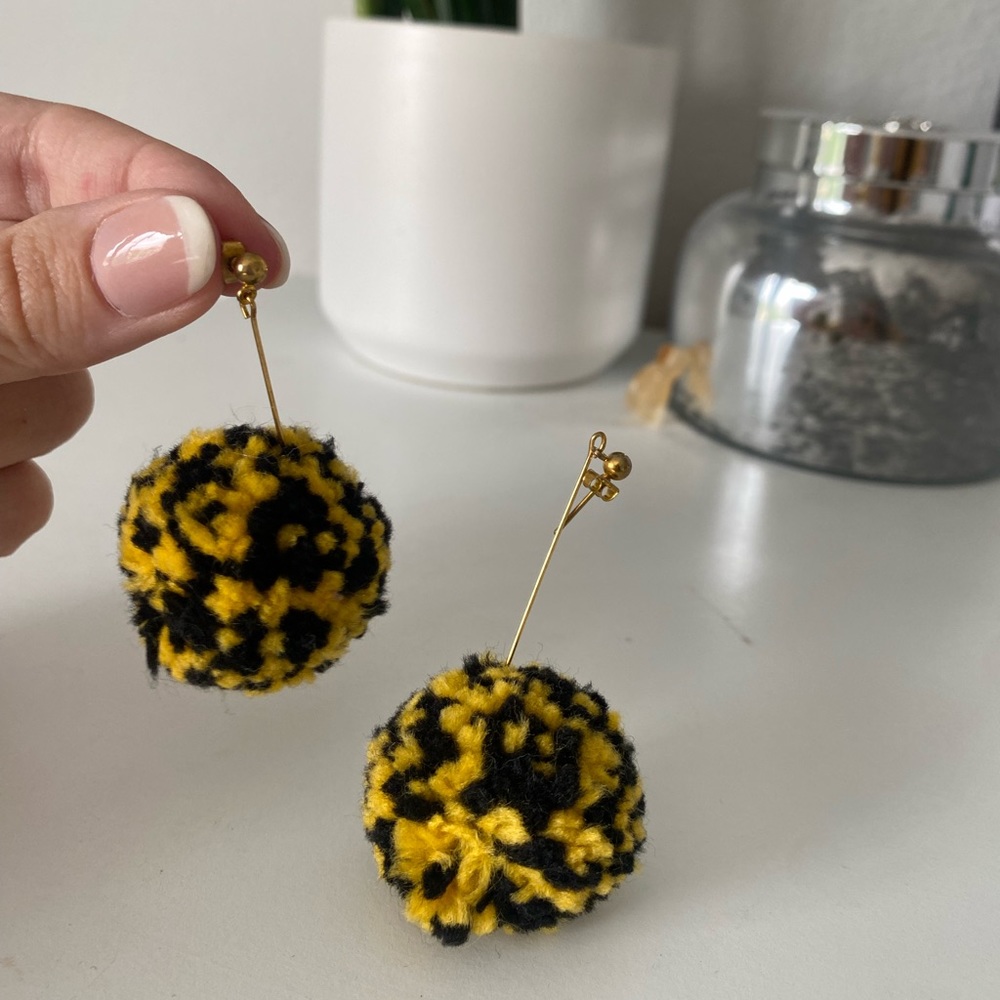 Black and gold pom earrings